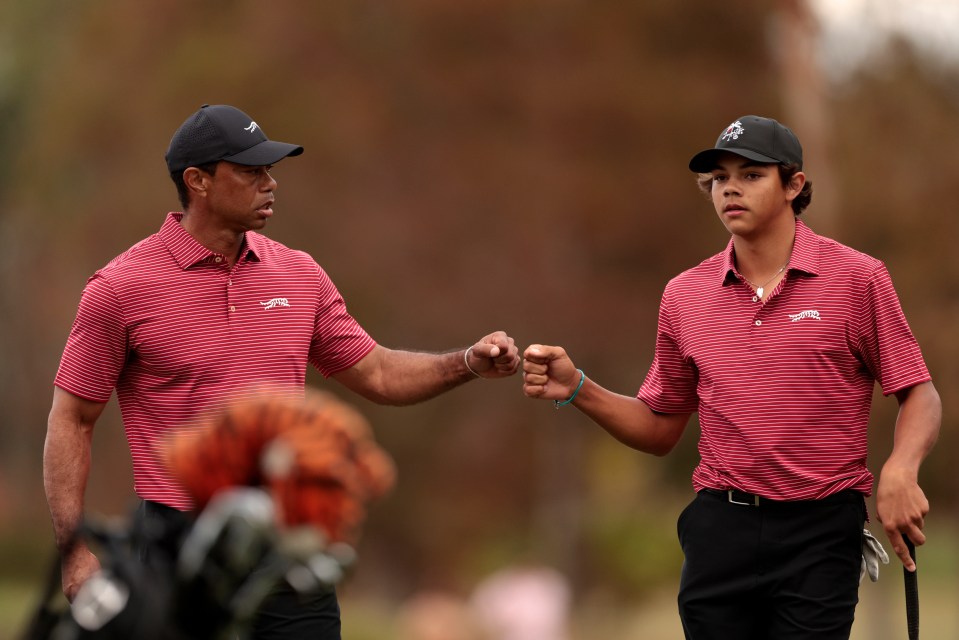 ORLANDO, FLORIDA - DECEMBER 22: Tiger Woods of the United States and his son Charlie Woods react on the 16th green during the second round of the PNC Championship at Ritz-Carlton Golf Club on December 22, 2024 in Orlando, Florida. (Photo by Douglas P. DeFelice/Getty Images)
